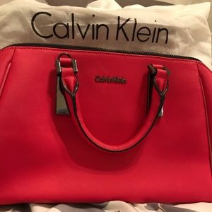 Red Calvin Klein handbag with strap